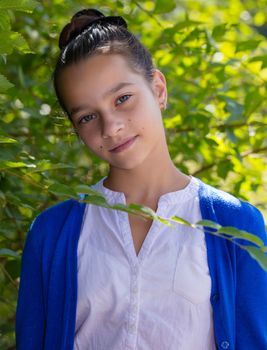 portrait of teen girl outdoors in the park