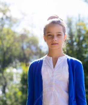 portrait of teen girl outdoors in the park