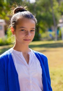 portrait of teen girl outdoors in the park