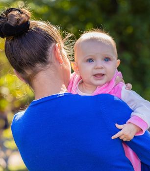 portrait of a smiling baby girl on hands