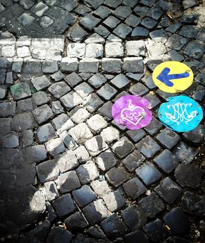 Aerial view of colored indication on a cobblestone street