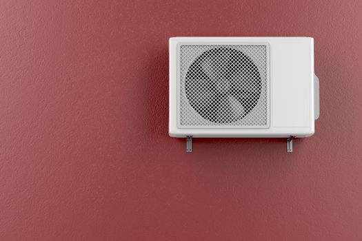 Air conditioner mounted on the red wall 
