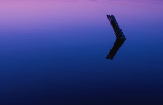 Reflection in the lake colorful bright orange blue sunset