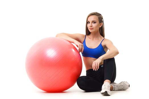 Concepts: healthy lifestyle, sport. Happy beautiful woman fitness trainer working out with fit ball isolated on white background