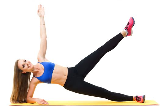 Concepts: healthy lifestyle, sport. Happy beautiful woman fitness trainer working out with yoga mat isolated on white background