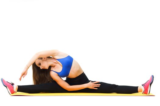 Concepts: healthy lifestyle, sport. Happy beautiful woman fitness trainer working out with yoga mat isolated on white background