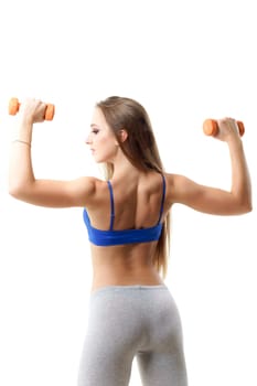 Concepts: healthy lifestyle, sport. Happy beautiful woman fitness trainer working out with small dumbbells isolated on white background