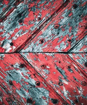 abstract background or texture peeled red paint on old wooden gate