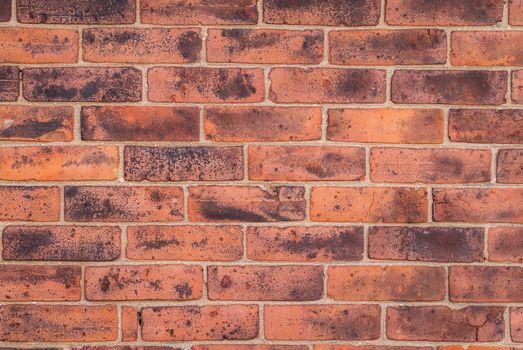 Weathered clay brick wall useful as a background.