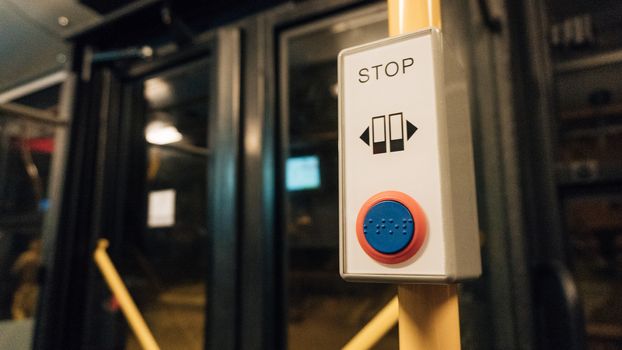 POLAND, KRAKOW - SEP 02, 2016: Stop button on a London City Bus