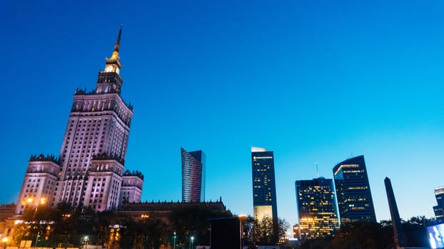 Warsaw, Poland. City center with Palace of Culture and Science, a landmark and symbol of Stalinism and communism, and modern sky scrapers.