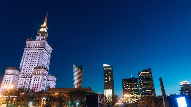 Warsaw, Poland. City center with Palace of Culture and Science, a landmark and symbol of Stalinism and communism, and modern sky scrapers.