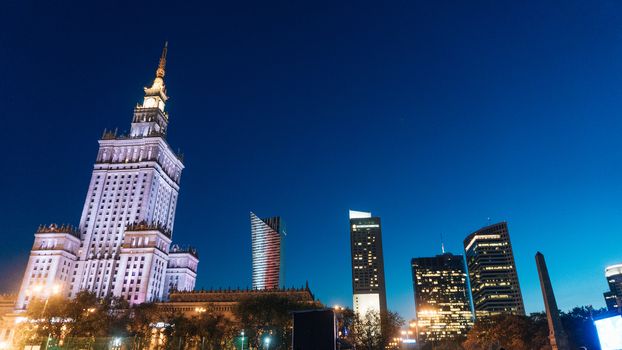 Warsaw, Poland. City center with Palace of Culture and Science, a landmark and symbol of Stalinism and communism, and modern sky scrapers.