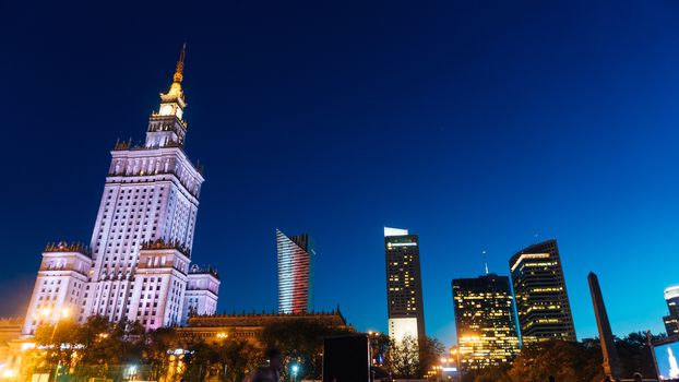 Warsaw, Poland. City center with Palace of Culture and Science, a landmark and symbol of Stalinism and communism, and modern sky scrapers.