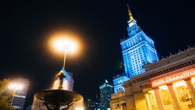 Warsaw, Poland. City center with Palace of Culture and Science, a landmark and symbol of Stalinism and communism, and modern sky scrapers.