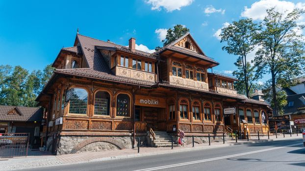 ZAKOPANE, POLAND - AUGUST 29, 2016: Tourists on a popular Krupowki street in Zakopane Poland.