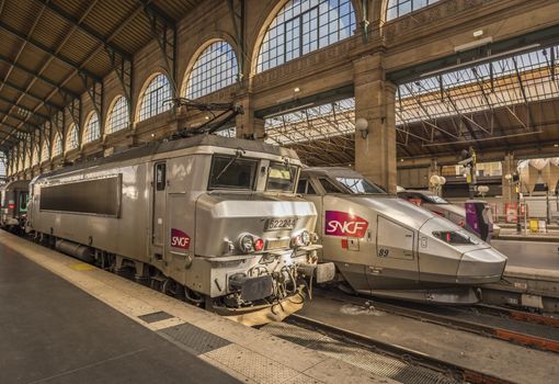 Paris, France - February 15, 2016:  Two different type of SNCF locomotives parked in Gare du Nord, Paris , France, on 15 February 2016