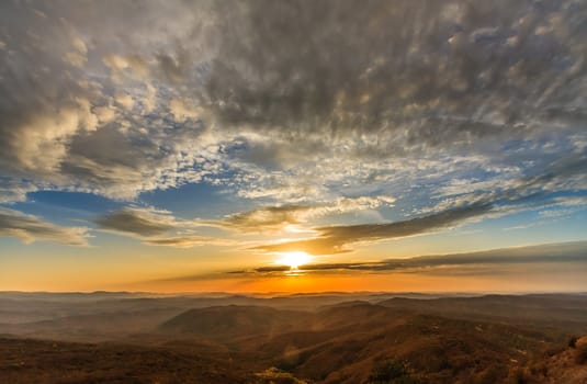 Panorama. Sunset sky above the autumn mountains.