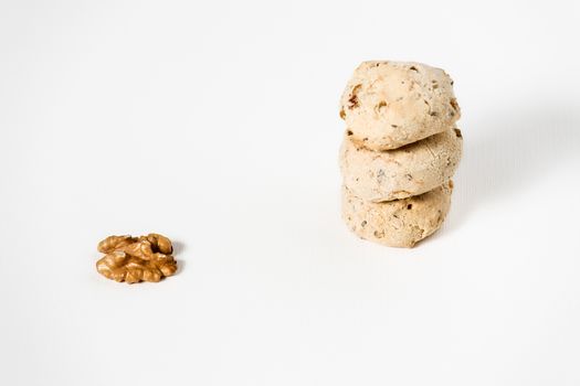 Cavallucci, typical Italian biscuits with walnut and candied fruit on a white background