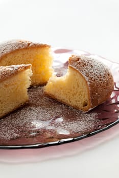 Slices of cake on a plate over a white background