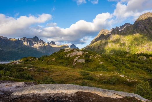 Colorful summer landscape with sharp mountain peaks in Norway.
