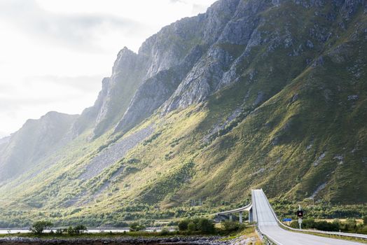 Lofoten, Norway. Road and bridge in dramatic landscape.