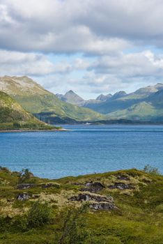 Colorful summer landscape with sharp mountain peaks in Norway.