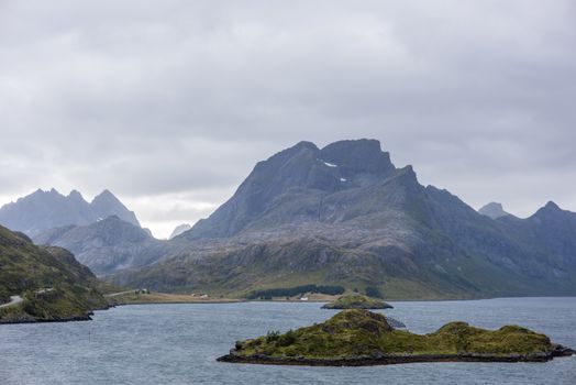 Dramatic summer landscape with sharp mountain peaks in Norway.