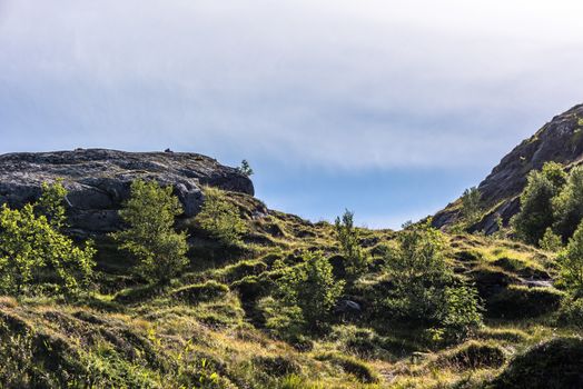 Colorful summer landscape with sharp mountain peaks in Norway.