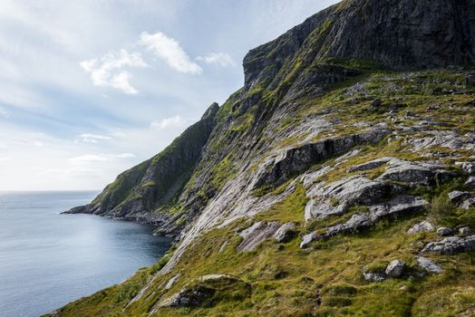 Colorful summer landscape with sharp mountain peaks in Norway.
