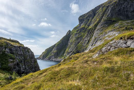 Colorful summer landscape with sharp mountain peaks in Norway.