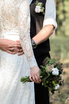 the groom and bride are hugging and holding hands