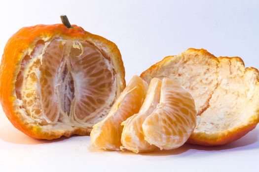peeled tangerine on white background. Ideal for layout