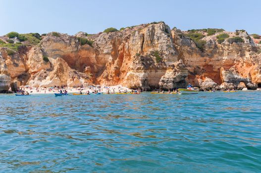 LAGOS, PORTUGAL - SEPTEMBER 1: Tourists sunbathe and swim at the beach on 1 September, 2014 in Lagos. 