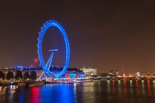 LONDON, UNITED KINGDOM - NOVEMBER 10, 2014: Night view of the South Bank of the River Thames including the world famous landmark, London Eye.