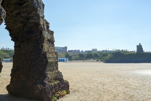 natural rock formation at the ballybunion cliffs with castle and beach
