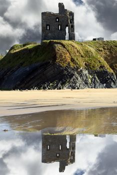 wild atlantic way castle and beach with beautiful reflections