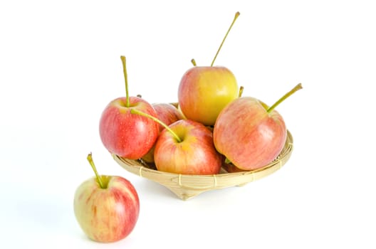 Red and yellow apple  with bamboo basket , organic fresh fruit.