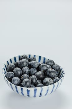 Blueberries in a bowl , organic fresh fruit