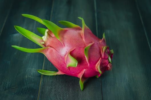 Ripe Dragon fruit  over wooden background , still life
