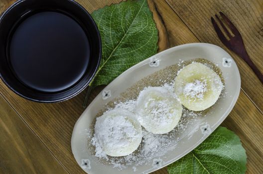 Daifuku Mochi Japanese dessert on dish over wooden background