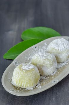 Daifuku Mochi Japanese dessert on dish over wooden background