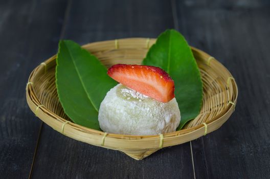 Strawberry Daifuku Mochi Japanese dessert on bamboo basket , still life