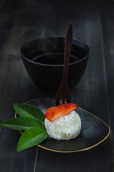 Strawberry Daifuku Mochi Japanese dessert with hot tea , still life