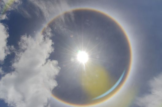 Sun with circular rainbow  sun halo occurring due to ice crystals in atmosphere in thai
