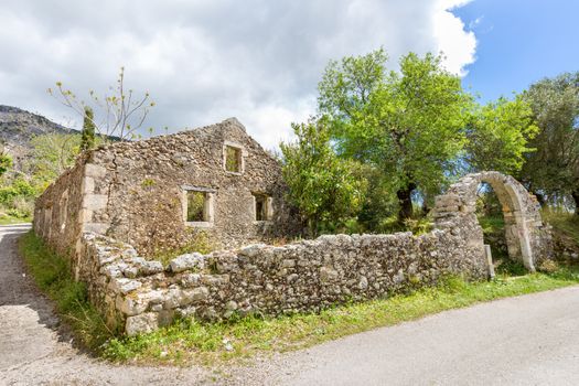 Old historic house as ruins along street in Kefalonia Greece