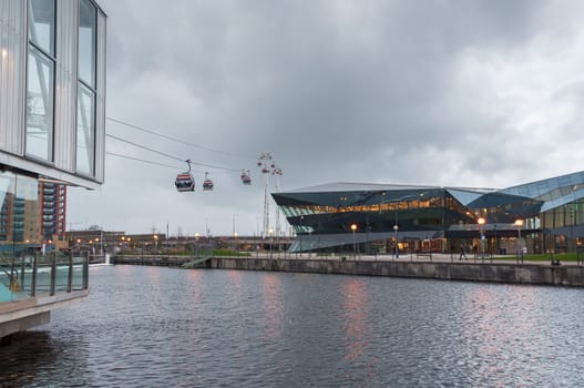 London, United Kingdom - November 8, 2014: Royal Victoria Docks cable car station on a rainy day. Emirates Air Line is a ten minute gondola lift link across the River Thames.