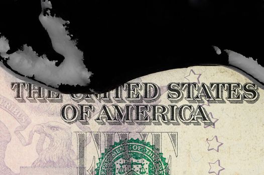 Petrol oil on top of american dollar banknote