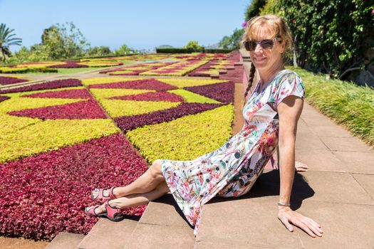 Caucasian woman as tourist in botanical garden