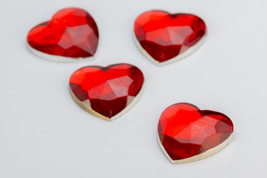 Four hearts in angular red glass
